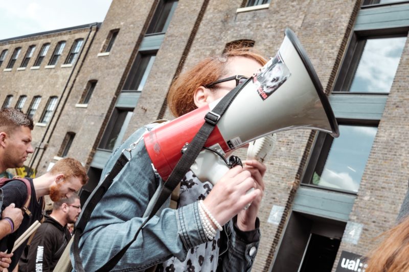 Protester with megaphone Protester with megaphone