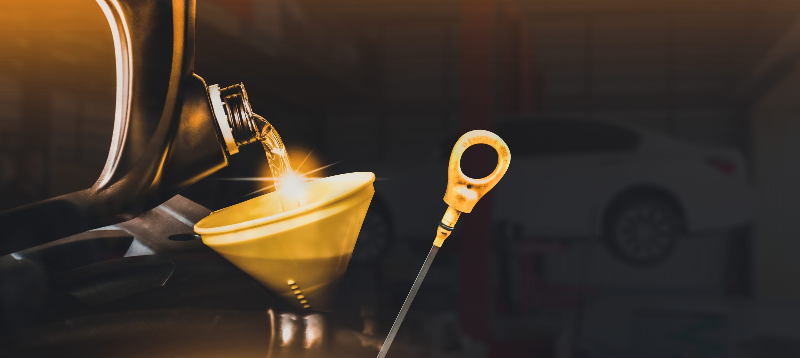 Mechanic,Pouring,Motor,Oil,To,Engine,With,Copy,Space,On